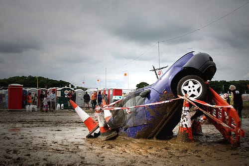 car in mud pit photo
