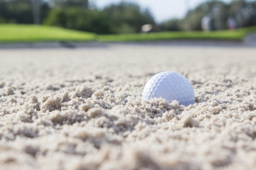 Golf ball in sand trap