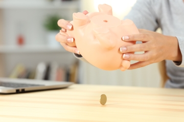 Upside down empty piggy bank