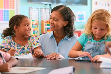 Teacher working with students