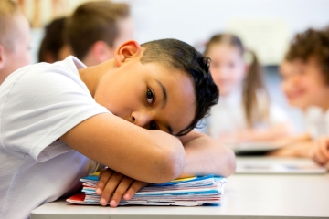 Student with head on desk