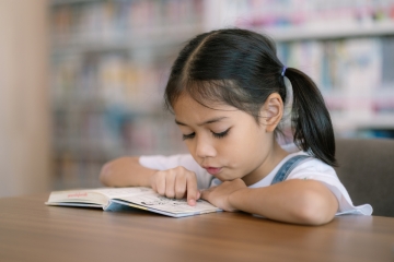 Child reading in school