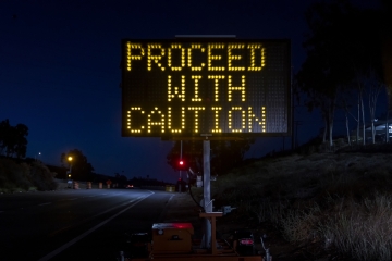 Proceed with caution road sign