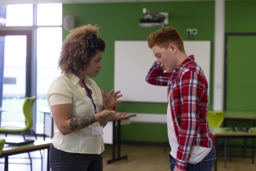 Teacher talking to a student