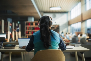 College student studying in library