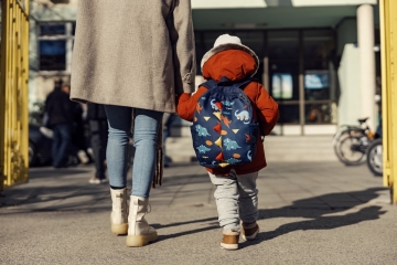 Parent and child walking to school