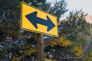 Road sign with two arrows