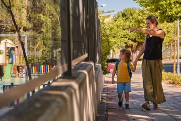 Parent walking with child to school