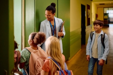 Teacher in a school hallway