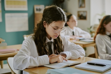 Student reading in class