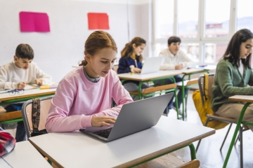 Student using a computer in class