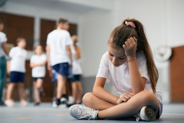 Sad student in gym class