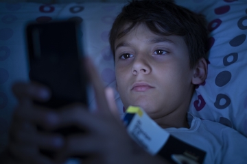 Teenager using a cellphone