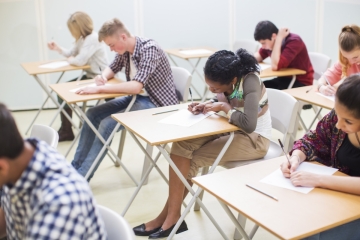 Teenagers at school taking a test