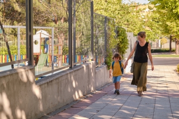 Parent and child walking to school