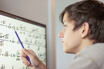 Teenage student doing math