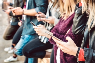 Teenagers using cellphones