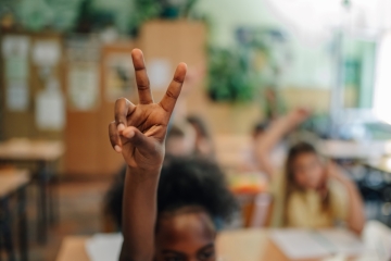 Student raising her hand