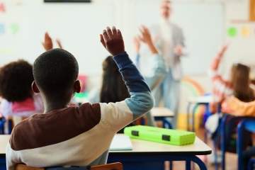 Students with hands raised