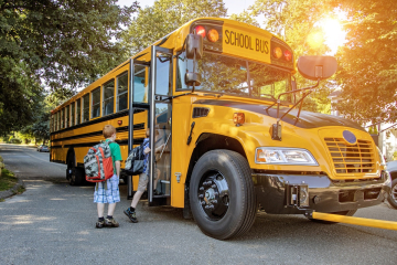 Kids boarding a school bus