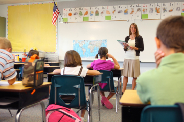 Teacher and classroom with students