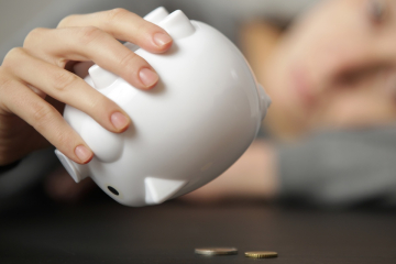 Shaking a piggy bank