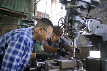 Students working on machine