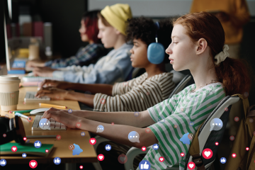 Students sit at laptops in a classroom while social media reaction icons and notification bubbles appear across the foreground.