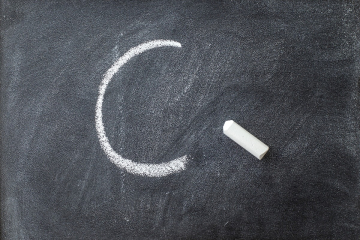C grade on a chalkboard