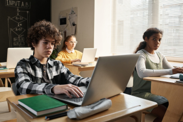 Sad students on computers