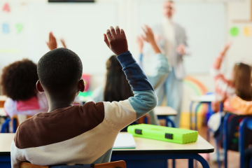 Students with hands raised