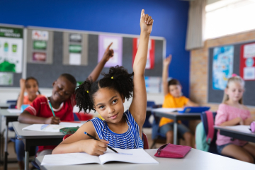 Students with hands raised