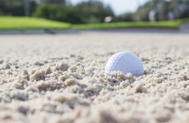 Golf ball in sand trap