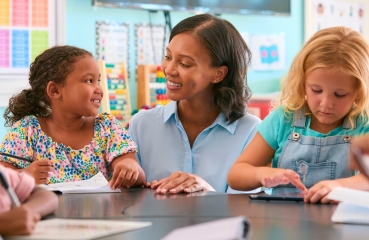 Teacher working with students