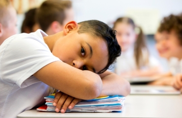 Student with head on desk