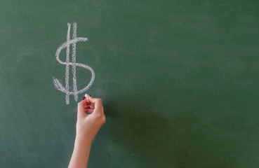 Dollar sign on a chalkboard