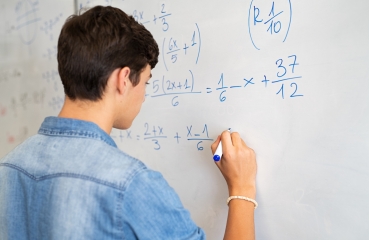 Student doing math in a classroom