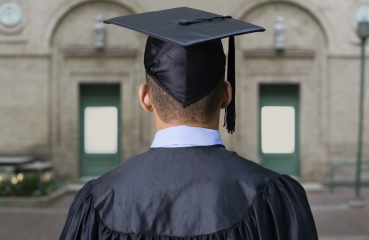 Graduate in a graduation cap and gown