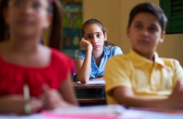 Bothered school student in a classroom