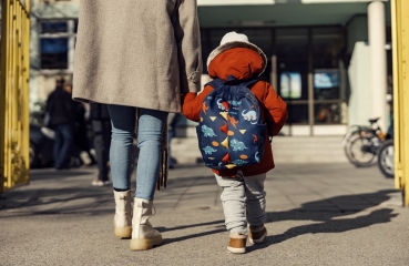 Parent and child walking to school