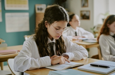 Student reading in class