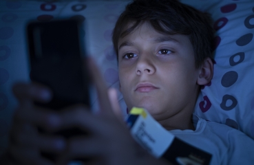 Teenager using a cellphone