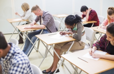 Teenagers at school taking a test