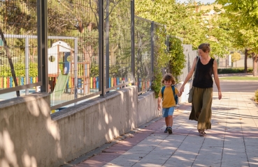 Parent and child walking to school