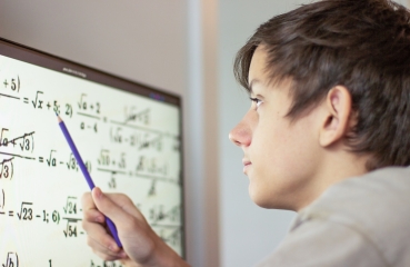 Teenage student doing math