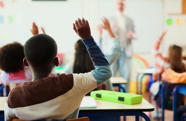 Students with hands raised