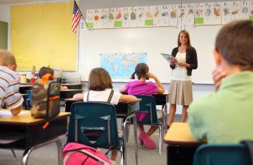 Teacher and classroom with students