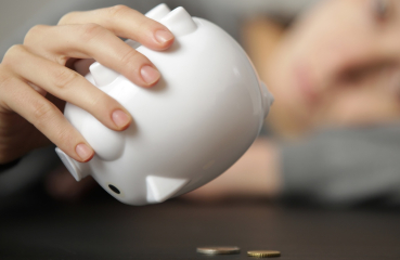 Shaking a piggy bank