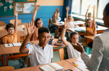 Students with hands raised