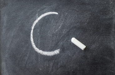 C grade on a chalkboard
